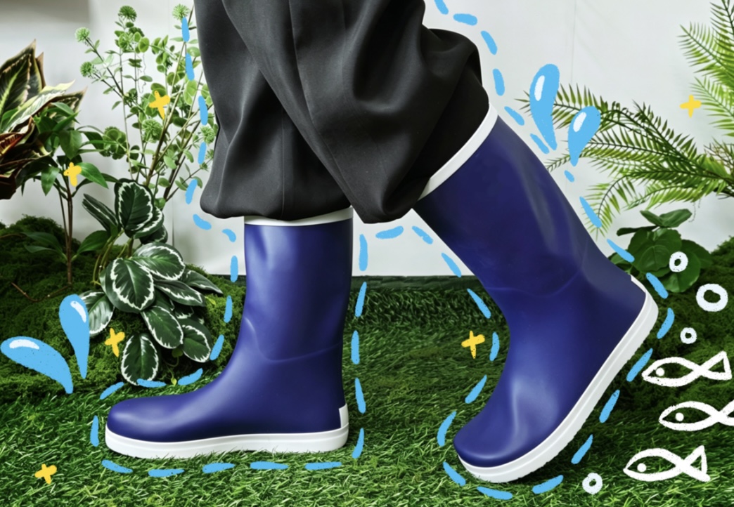 215f90c0-312f-4257-8e2c-075915fb94fc_Blue mid calf waterproof rubber rain boots with white sole on green moss plant background, cute hand drawn water splash and fish doodles.jpg